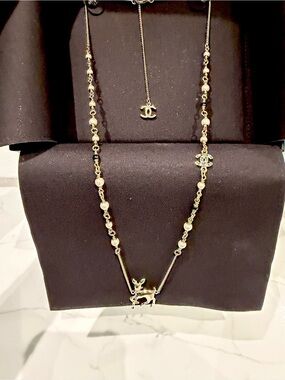 CHANEL Gold-Tone Reindeer and CC Charm Long Necklace